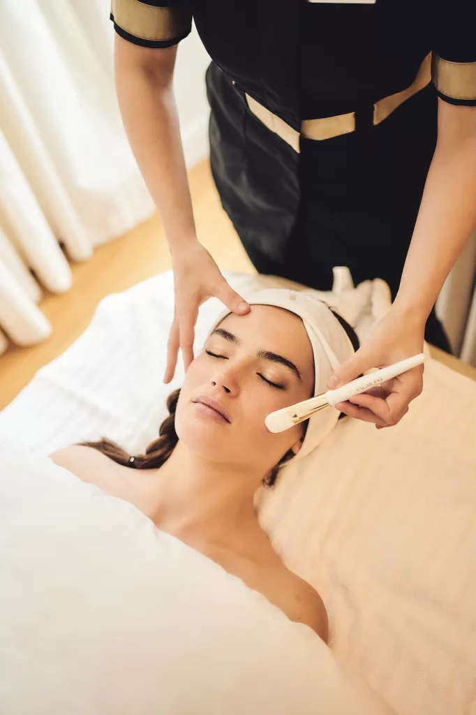 Bride enjoying a calming facial treatment at the Grand Hotel du Lac spa before the wedding day.