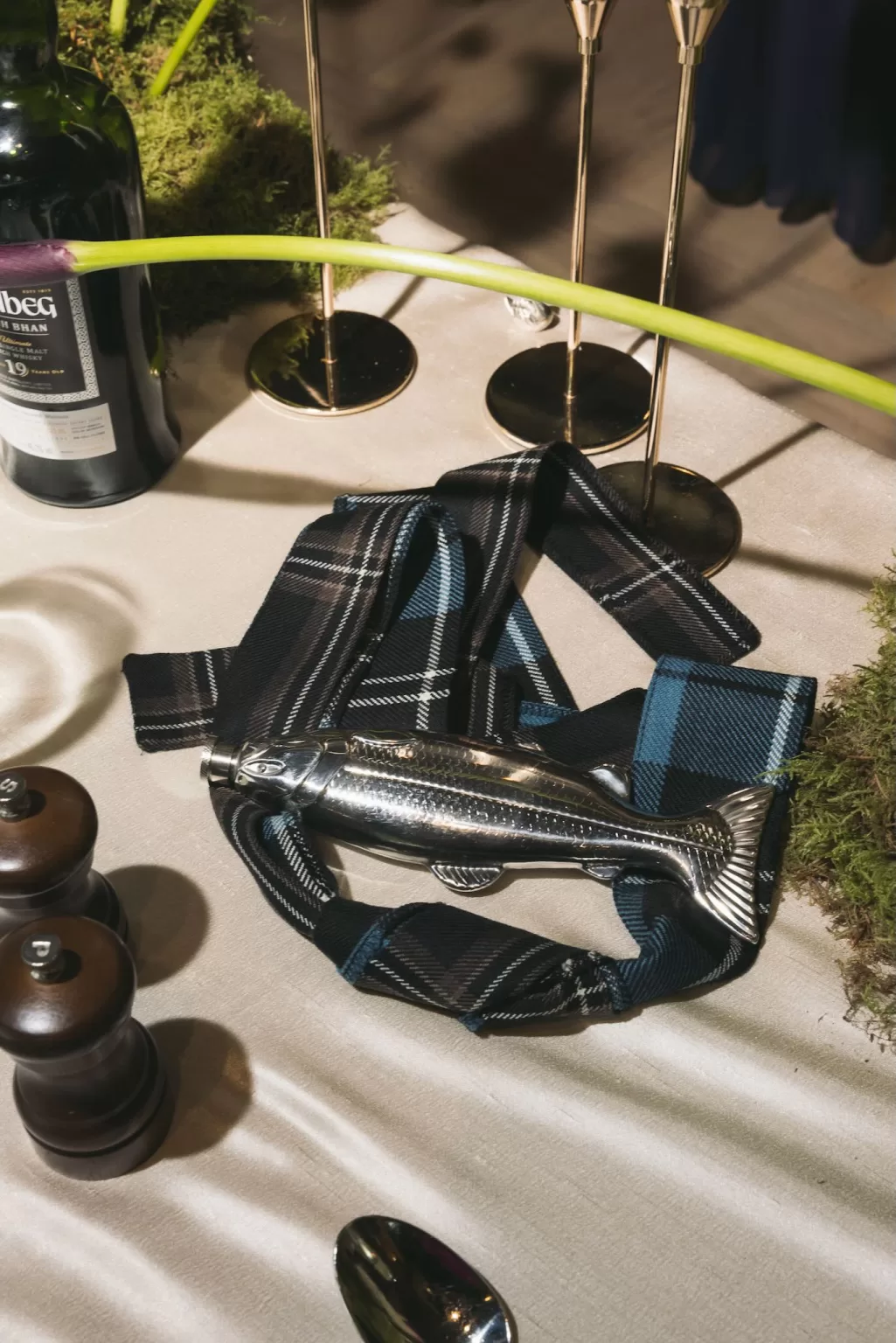 Scottish wedding table details with tartan, candles and traditional elements at Boturich Castle.