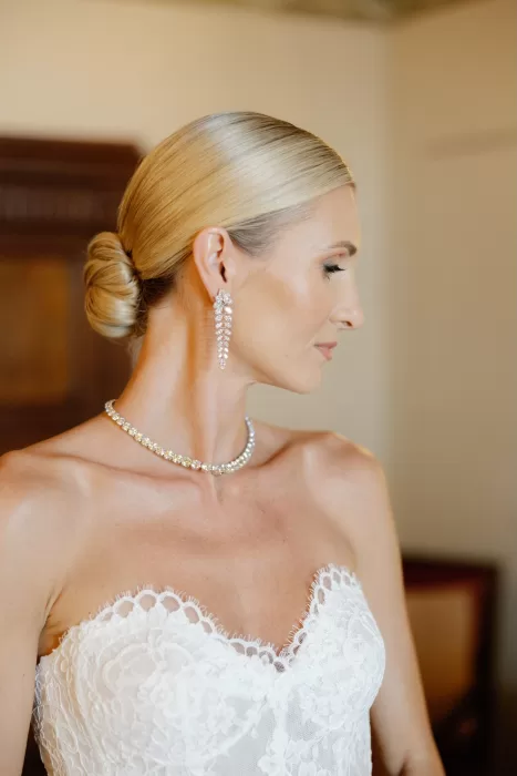 Elegant bridal portrait showcasing lace wedding dress and diamond jewellery at Castello di Velona.