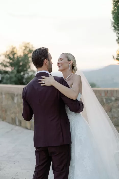 Romantic first dance moment at sunset overlooking the hills at Castello di Velona.
