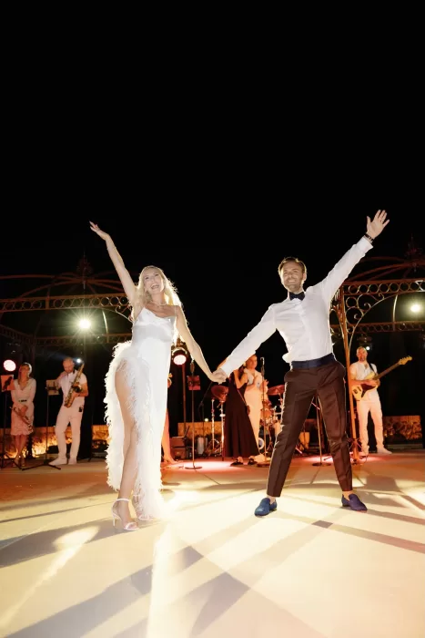 Bride and groom dancing together during live band performance at Castello di Velona.