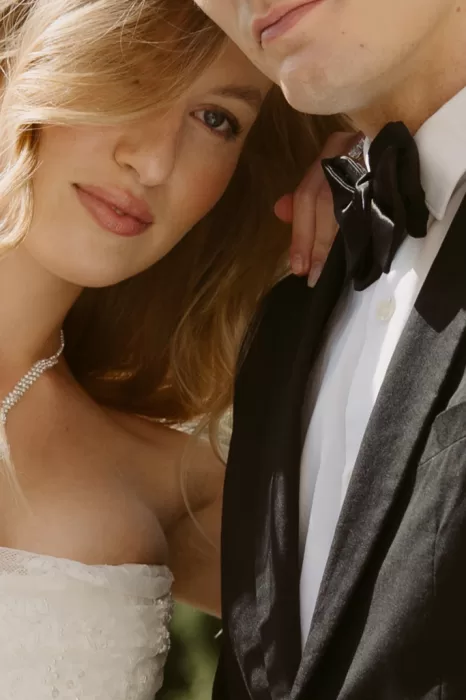 Close-up portrait of the bride and groom showing elegant styling and soft natural light at Château du Prieuré d’Evecquemont.