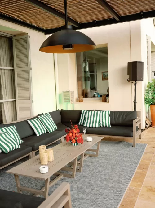 Outdoor lounge seating arranged on the terrace for a wedding celebration at Domaine de Canaille