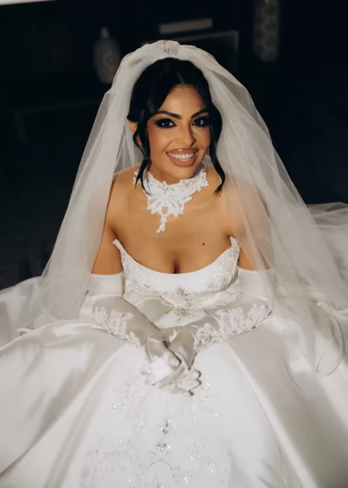 Close portrait of the bride at Palacio Metropolitano smiling beneath her veil in an elegant lace choker gown.