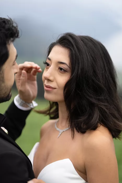 Elegant close-up portrait of the bride wearing a diamond necklace during her Villa Honegg wedding.