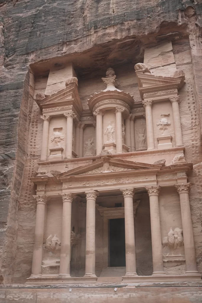 Detailed view of Petra Treasury façade with carved columns and intricate stonework near Wadi Rum wedding destination.