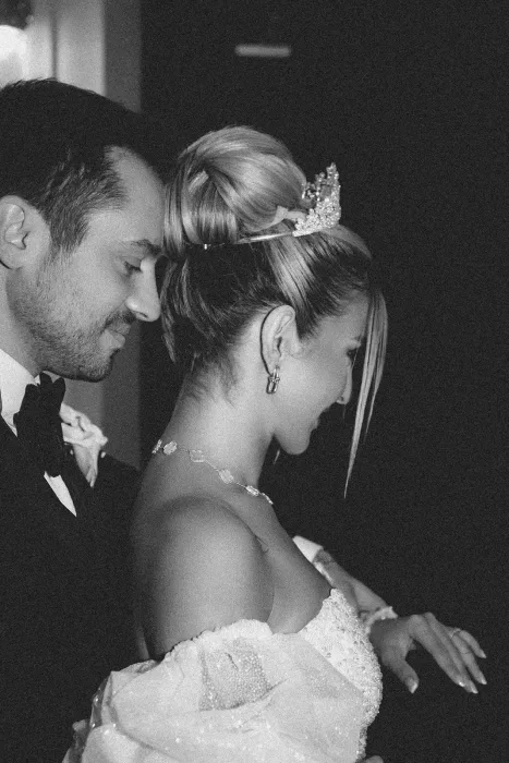 Intimate black and white portrait of bride and groom sharing a quiet moment before the celebration at Château Bouffémont.
