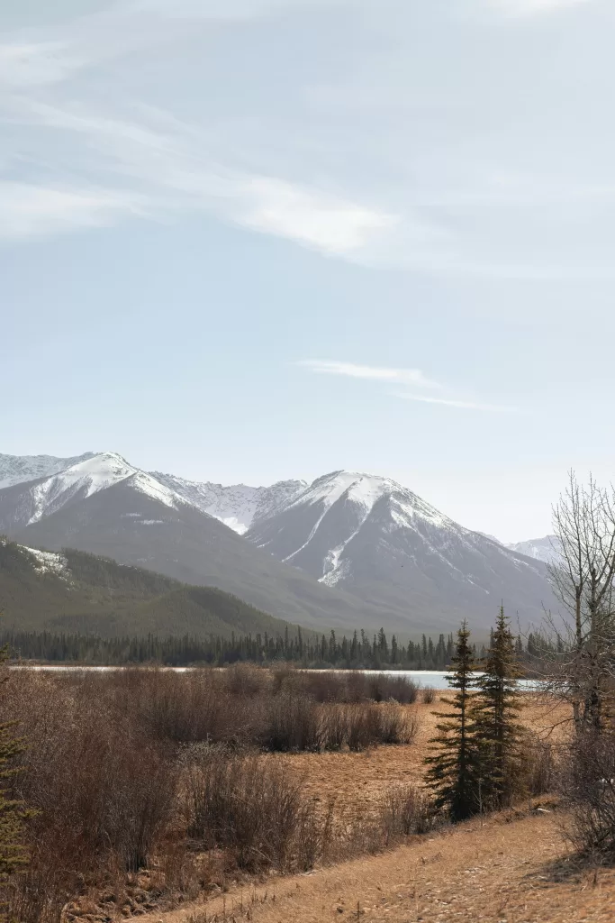 Beautiful view of snow-capped mountains and serene landscape in Banff, Alberta, Canada.