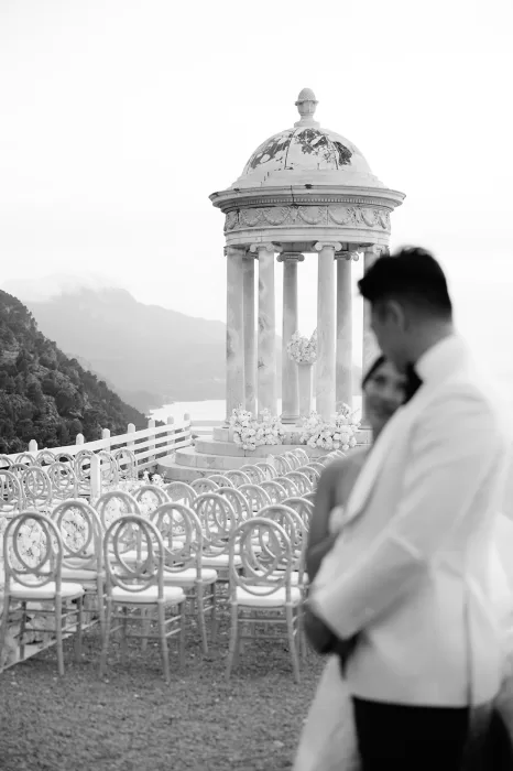 Rows of ceremony chairs facing the marble temple at Son Marroig with coastal views in soft light