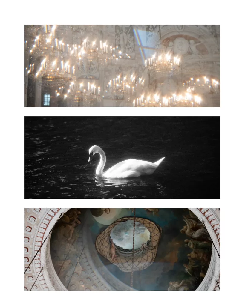 Soft focus chandeliers glowing inside an ornate historic ballroom with rainbow light reflections