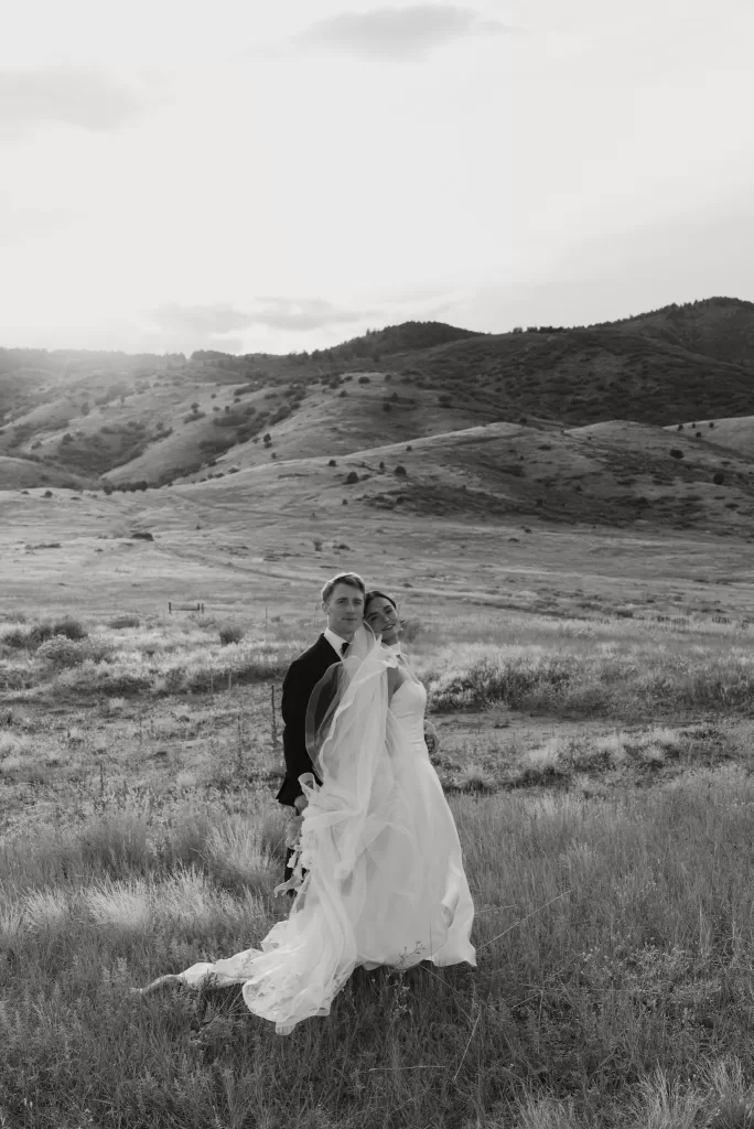 Black and white portrait of the couple in the Colorado landscape near The Manor House.