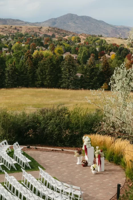 Soft, dreamy ceremony moment as the couple exchange vows outdoors at The Manor House.