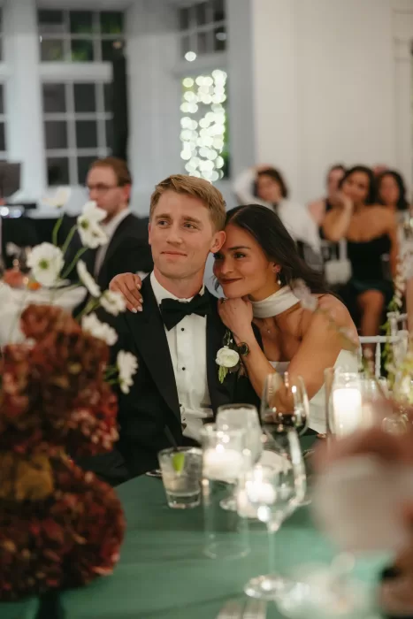 Couple sharing a quiet, affectionate moment during the reception at The Manor House.