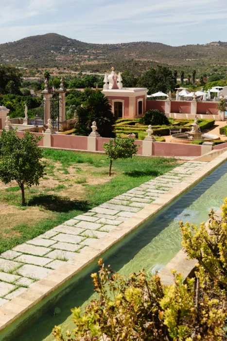 Formal gardens and reflecting pool at Pousada Palácio Estoi in the Algarve