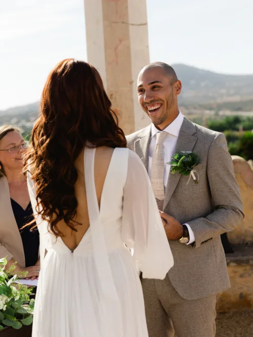 Groom smiling during an intimate wedding ceremony on the terrace at Pousada Palácio Estoi