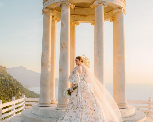 Bride posing gracefully during sunset, with warm golden light casting a beautiful glow on her.