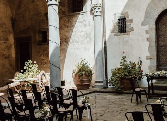 Exquisite wedding decor centerpieces at a reception in Castello del Trebbio, Italy.