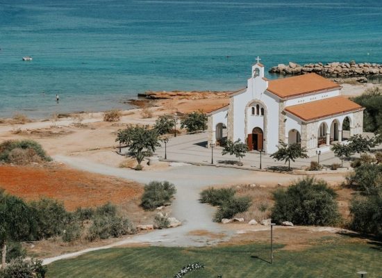 The beautiful outdoor ceremony setup at Cavo Zoe, overlooking the sea, captured by Sasha Grishina