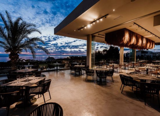 Elegant wedding reception setup at Cavo Zoe in Cyprus, featuring chic decor and lighting.