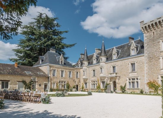 The majestic facade of Chateau de la Couronne, a luxurious wedding venue in the French countryside.