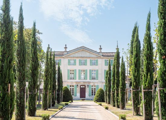 Front view of Chateau de Tourreau, highlighting its classic French architecture and picturesque setting.