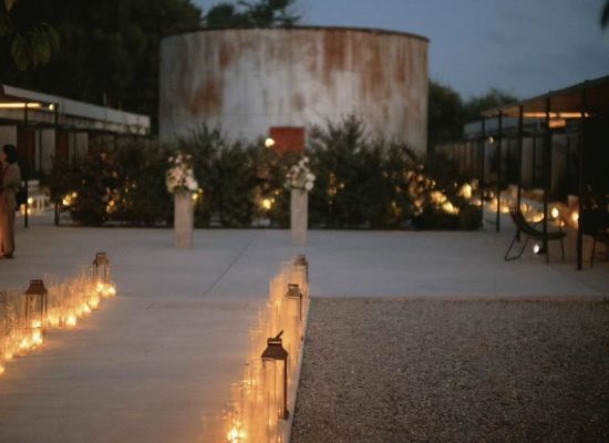 Candlelit wedding reception tablescape at Dexamenes Seaside Hotel in Greece, creating a romantic atmosphere by the sea.