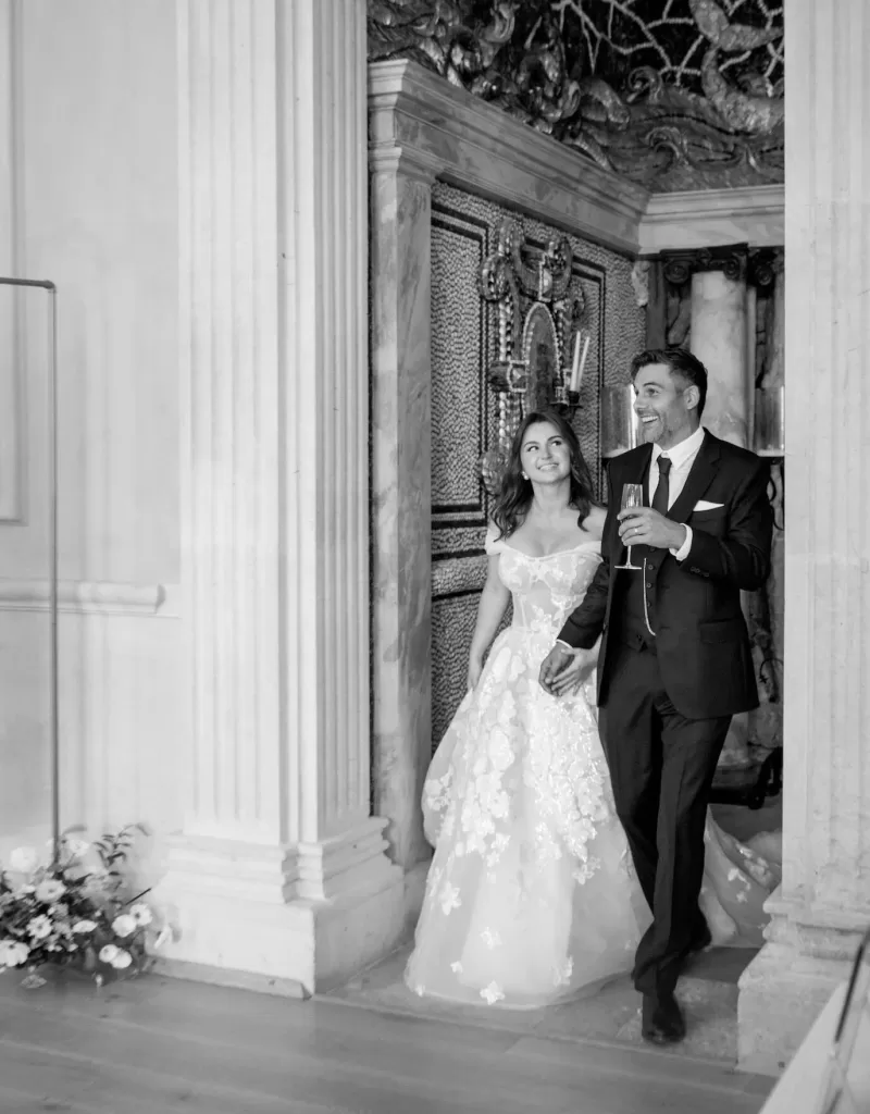 Just married, the couple enters the reception space at Euridge Manor, beaming with joy.