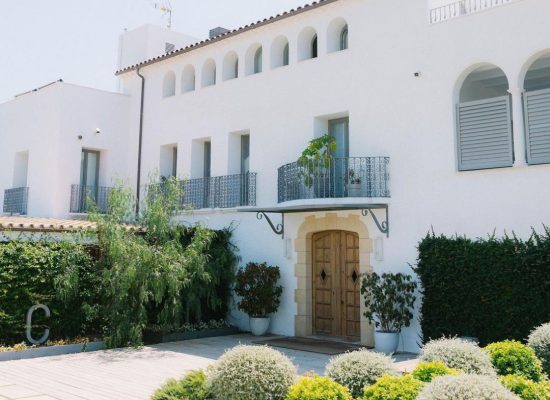 Grand entrance of Masía Casa Del Mar, a luxurious wedding venue in Spain.