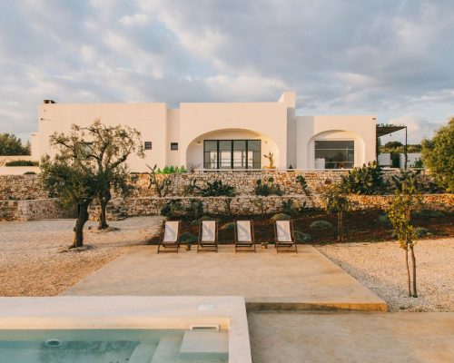 A serene terrace lounge at Masseria Morosetta, offering views of the surrounding olive groves, captured by Salva Lopez.