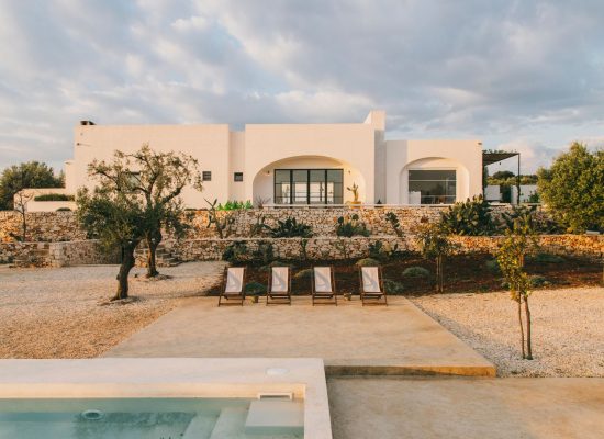 A serene terrace lounge at Masseria Morosetta, offering views of the surrounding olive groves, captured by Salva Lopez.